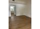 Living room with wood floors leading to the bathroom at 229 Doverwood Rd, Fern Park, FL 32730