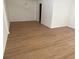 Open living room with updated laminate floors, a modern chandelier, and neutral paint at 229 Doverwood Rd, Fern Park, FL 32730