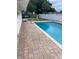 Backyard pool featuring a brick paver surround and well-maintained privacy fence at 229 Doverwood Rd, Fern Park, FL 32730