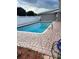 Outdoor pool with brick paver decking and privacy fence, ideal for relaxation and leisure at 229 Doverwood Rd, Fern Park, FL 32730