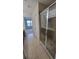 Bathroom with a glass shower stall and tile flooring, leading to the bedroom at 2355 Seven Oaks Dr, St Cloud, FL 34772