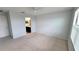Bright bedroom with neutral carpet and light walls, with an ensuite bathroom at 2355 Seven Oaks Dr, St Cloud, FL 34772