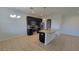 Kitchen featuring stainless steel appliances, dark cabinets, granite counters, and tile floors at 2355 Seven Oaks Dr, St Cloud, FL 34772