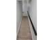 Carpeted stairway with a dark railing and a classic chandelier, leading to the upper level of the home at 2355 Seven Oaks Dr, St Cloud, FL 34772