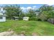 A view of the spacious backyard with shed and carport at 2538 Meadowview Ln, Deland, FL 32720