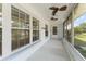 View of the home's screened-in porch and front door at 2538 Meadowview Ln, Deland, FL 32720
