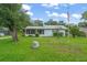 Charming single-story home with a well-manicured lawn and an American flag proudly displayed at 2538 Meadowview Ln, Deland, FL 32720