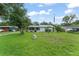 Charming single-story home with a well-maintained lawn and a screened-in porch for relaxing outdoors at 2538 Meadowview Ln, Deland, FL 32720