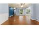 Living room featuring hardwood floors, a ceiling fan, and views into the adjacent rooms at 2538 Meadowview Ln, Deland, FL 32720