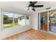 The sunroom features lots of natural light with sliding glass doors to the adjacent living area at 2538 Meadowview Ln, Deland, FL 32720