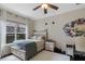 Cozy bedroom with natural light, adorned with vintage decor, complemented by classic furnishings at 25554 Hawks Run Ln, Sorrento, FL 32776
