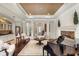 Open living space with dark hardwood floors, a fireplace, and plenty of seating at 25554 Hawks Run Ln, Sorrento, FL 32776
