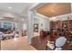 Elegant home featuring decorative columns, hardwood floors, and sophisticated decor at 25554 Hawks Run Ln, Sorrento, FL 32776