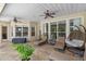 Inviting covered patio with tile flooring, ceiling fans, and comfortable seating at 25554 Hawks Run Ln, Sorrento, FL 32776