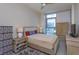 Well-lit bedroom featuring neutral tones, a cozy rug, and modern furnishings at 260 S Osceola Ave # 902, Orlando, FL 32801
