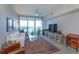 Bright living room with large windows and modern decor, including a comfortable sofa at 260 S Osceola Ave # 902, Orlando, FL 32801