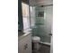Beautiful bathroom featuring a tiled shower with glass doors, tiled floors, and a vanity at 2833 Woodruff Dr, Orlando, FL 32837
