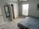 Bedroom with tiled floors, a ceiling fan, a closet, and a window with blinds at 2833 Woodruff Dr, Orlando, FL 32837