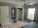 Bedroom with tiled floors, a ceiling fan, a closet, and a window with blinds at 2833 Woodruff Dr, Orlando, FL 32837