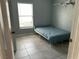 Bedroom with tiled floors, a ceiling fan, a window with blinds, and shelves at 2833 Woodruff Dr, Orlando, FL 32837