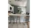Open kitchen features a breakfast bar with barstool seating and stainless steel appliances at 2833 Woodruff Dr, Orlando, FL 32837