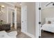 Bathroom with glass shower and door into the main bedroom suite at 2937 Butler Bay N Dr, Windermere, FL 34786