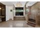 Luxurious bathroom with soaker tub, glass shower, and natural stone accents at 2937 Butler Bay N Dr, Windermere, FL 34786