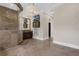 Large bathroom with a large walk-in shower, wall-mounted TV, and stone floors at 2937 Butler Bay N Dr, Windermere, FL 34786