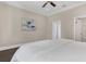 Bedroom with hardwood flooring, neutral walls, and a comfy bed at 2937 Butler Bay N Dr, Windermere, FL 34786