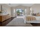 Bedroom featuring dark wood floors and doors to the outdoor patio, great natural light at 2937 Butler Bay N Dr, Windermere, FL 34786