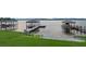 A picturesque view of waterfront boat docks and meticulously maintained landscaping at 2937 Butler Bay N Dr, Windermere, FL 34786