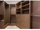 Spacious walk-in closet with shelving and drawers for optimal organization at 2937 Butler Bay N Dr, Windermere, FL 34786