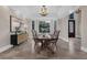 Bright dining area with a bay window, stylish lighting, and comfortable seating at 2937 Butler Bay N Dr, Windermere, FL 34786