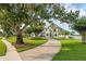 Charming house with a brick driveway, mature trees, and picturesque setting at 2937 Butler Bay N Dr, Windermere, FL 34786