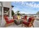 Outdoor gathering space offers a stone fire pit and comfortable seating, with a stunning lake view at 2937 Butler Bay N Dr, Windermere, FL 34786