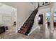 Grand foyer featuring a staircase, tile flooring, and views to other living spaces at 2937 Butler Bay N Dr, Windermere, FL 34786