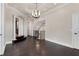 Elegant hallway boasts dark wood floors, staircase, and elegant trim at 2937 Butler Bay N Dr, Windermere, FL 34786
