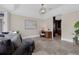 Bright living room features a work space, neutral decor, and views into other parts of the home at 2937 Butler Bay N Dr, Windermere, FL 34786