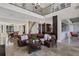 Open-concept living room features a cozy seating area and easy access to dining and kitchen at 2937 Butler Bay N Dr, Windermere, FL 34786