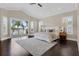 Bright main bedroom featuring dark wood floors and a patio with lake views at 2937 Butler Bay N Dr, Windermere, FL 34786