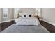 Main bedroom features white bedding and neutral decor with lots of natural light at 2937 Butler Bay N Dr, Windermere, FL 34786