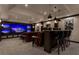 Luxurious media room with leather seating, bar area, and multi-screen display at 2937 Butler Bay N Dr, Windermere, FL 34786