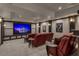 Home media room features tiered seating, large screen and movie decor at 2937 Butler Bay N Dr, Windermere, FL 34786