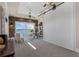Bright office space with stone accent wall, desk, chairs, and large sliding doors opening to a lake view at 2937 Butler Bay N Dr, Windermere, FL 34786