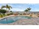Beautiful pool and spa overlooking a tranquil lake, offering a peaceful and luxurious outdoor space at 2937 Butler Bay N Dr, Windermere, FL 34786