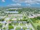 Expansive aerial view of a residential neighborhood with a lake, showcasing community and serene environment at 3010 Brandywine Dr, Orlando, FL 32806