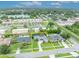 Aerial view of a lovely home with well-kept lawn and mature trees, with property lines outlined in yellow at 3010 Brandywine Dr, Orlando, FL 32806