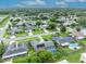 Overhead scene of homes with verdant yards, displaying solar panels, a pool, and the neighborhood layout at 3010 Brandywine Dr, Orlando, FL 32806