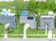 Aerial view of a home with a private backyard pool and solar panels, nestled in a serene neighborhood at 3010 Brandywine Dr, Orlando, FL 32806