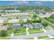 Aerial view showing a property with well-maintained greenery near a scenic lake at 3010 Brandywine Dr, Orlando, FL 32806